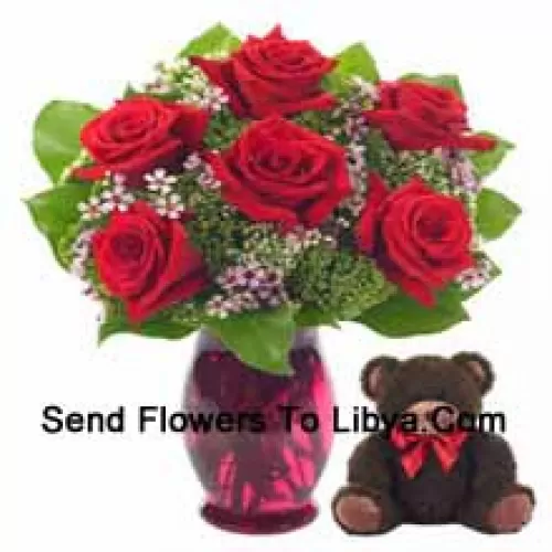 6 Red Roses With Some Ferns In A Glass Vase Along With A Cute 14 Inches Tall Teddy Bear