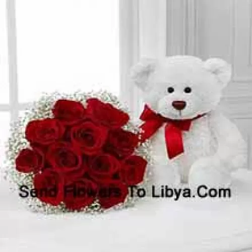 Bouquet de 12 roses rouges avec des remplisseurs saisonniers accompagné d'un mignon ours en peluche blanc de 14 pouces de hauteur