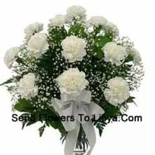 18 White Carnations With Seasonal Fillers In A Glass Vase