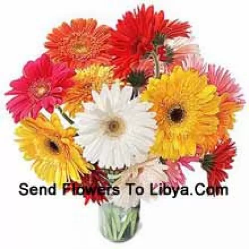 18 Mixed Colored Gerberas With Some Ferns In A Glass Vase