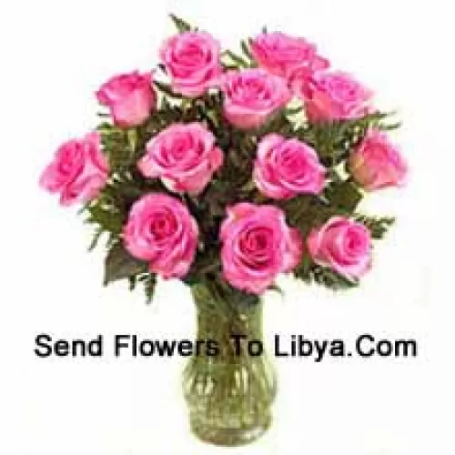 12 Pink Roses With Some Ferns In A Vase