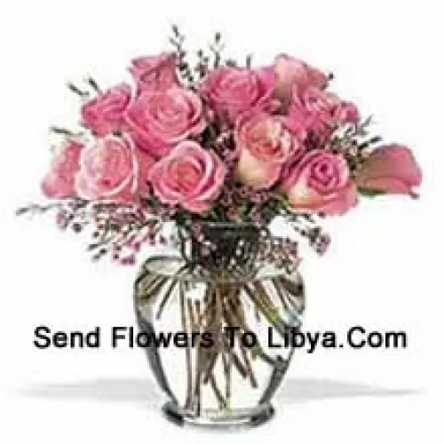 Bunch Of 12 Pink Roses With Some Ferns In A Vase