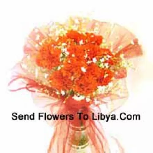 12 Orange Carnations With Some Ferns In A Vase