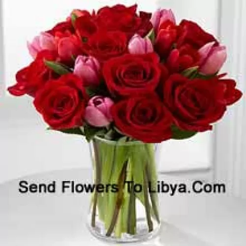 12 Red Roses And 6 Pink Tulips With Some Seasonal Fillers In A Glass Vase