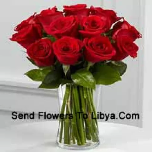 12 Red Roses With Some Ferns In A Vase