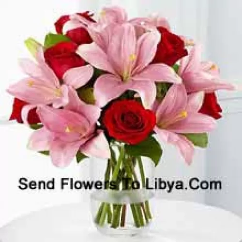 Red Roses And Pink Lilies With Seasonal Fillers In A Glass Vase