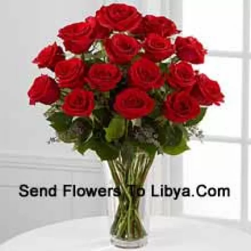 18 Red Roses With Some Ferns In A Vase