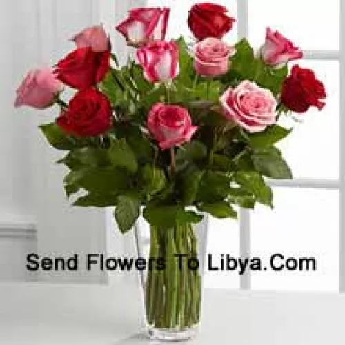 4 Red, 4 Pink And 4 Dual Toned Roses With Seasonal Fillers In A Glass Vase