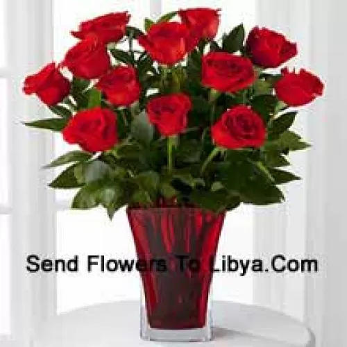 12 Red Roses With Some Ferns In A Vase