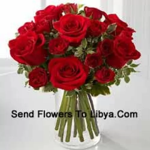 18 Red Colored Roses In A Glass Vase